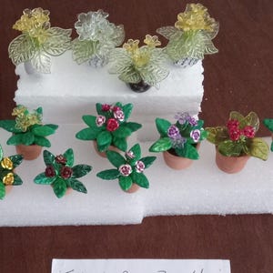 Bobbin Lace divider pins that are fun on your lace pillow. 6.70 each for Flower Pots, variety of colored flowers.  makes a great gift.