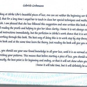 May include: A page from a book about lace making, featuring text by Gabriele Grohmann. The text discusses Ulrike L&ouml;hr's techniques and methods for creating lace. The page has a decorative border and a number 3 in the bottom right corner.