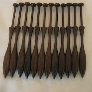 12x International square bobbins in single heads 23.50 dz for Bobbin Lace making. Acacia wood too 27.50 dz. also known as Square Danish
