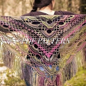 May include: A crochet shawl with a colorful, lacy pattern and fringe. The shawl is made with a variety of shades of green, purple, and pink yarn. The text "PDF PATTERN" is visible in the center of the shawl.