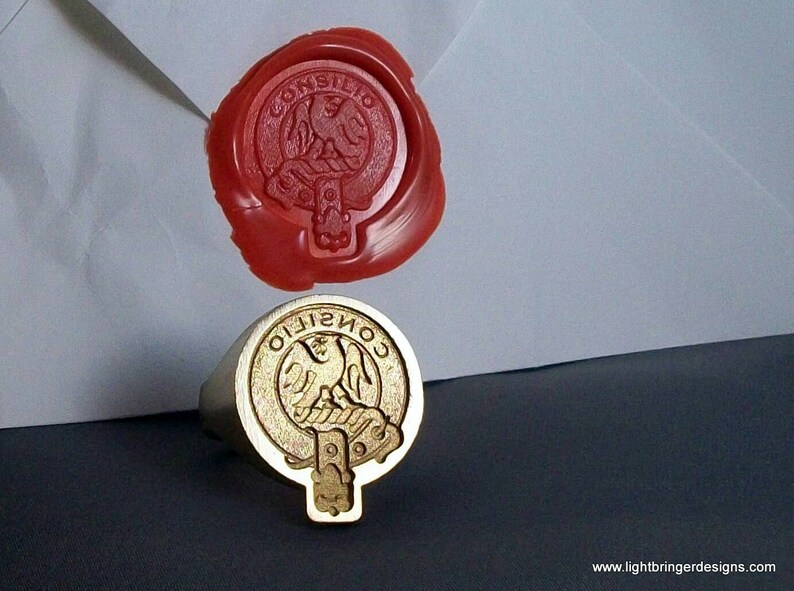 May include: A gold ring with a red wax seal impression. The seal features a crest with a bird and the text "CONSILIO".