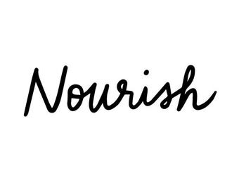May include: Handwritten calligraphy in black ink that says "Nourish".