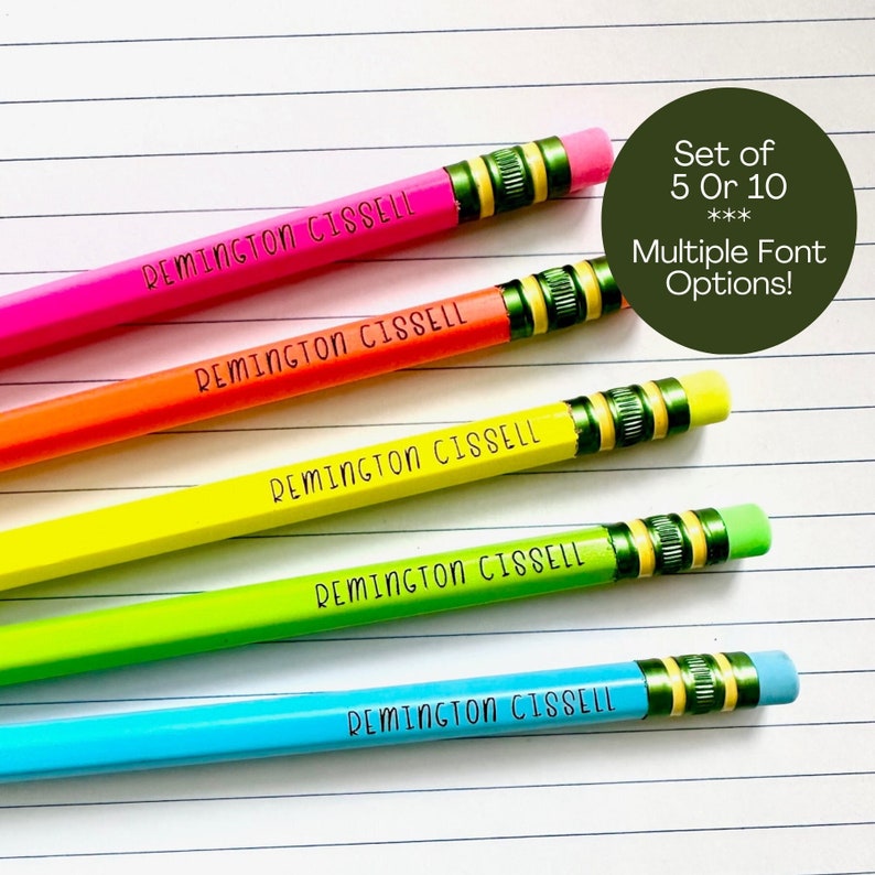 May include: Five colorful pencils with a black eraser and a green band. Each pencil is labeled "REMINGTON CISSELL". The text "Set of 5 Or 10***Multiple Font Options!" is in a green circle.