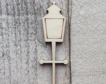 May include: A wooden cutout of a street lamp with a simple design. The lamp is made of unfinished wood and has a rounded top with a rectangular light fixture.