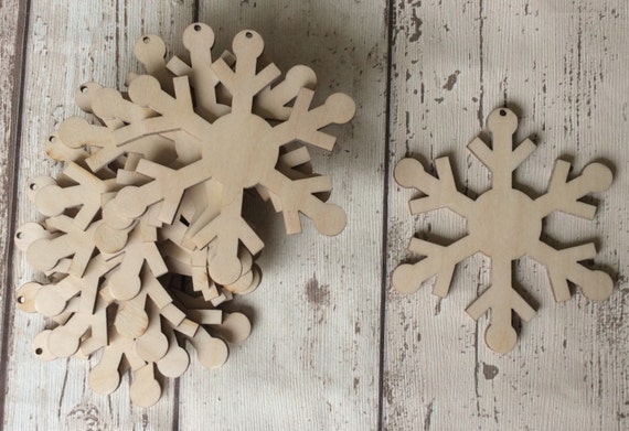 pack of 10 unpainted laser cut christmas snowflakes perfect for Christmas crafting, beautiful detailing
