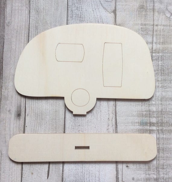 Laser cut adorable large wood freestanding caravan on plinth.