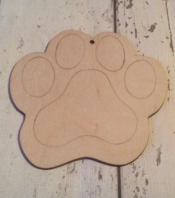 pack of 10 unpainted laser cut wood dog cat paws perfect for crafting, in 2 sizes, with one or two holes