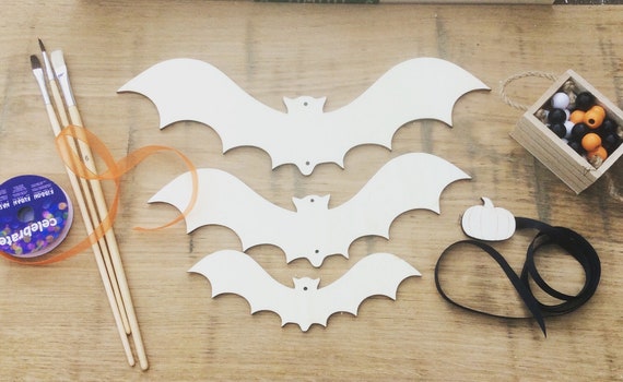 Set of 3 laser cut wooden descending bats. Perfect for Halloween decor