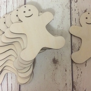 paquete de 10 muñecos de jengibre en blanco cortados con láser sin pintar, perfectos para manualidades navideñas, disponibles en 2 tamaños