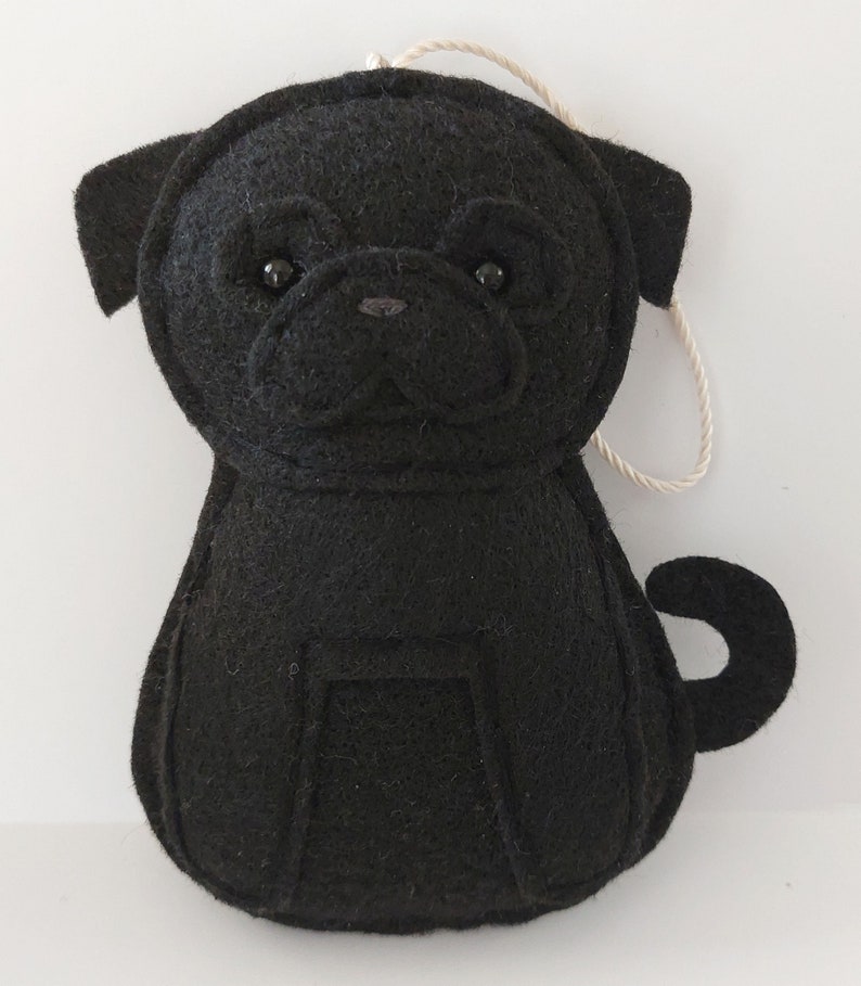 May include: Black felt pug dog ornament with a string loop for hanging.