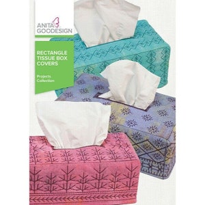 May include: Three rectangular tissue box covers with different patterns. The covers are made of fabric and have a quilted look. The patterns are a teal blue with white snowflakes, a purple with white stars, and a pink with brown trees. The text on the image reads "Rectangle Tissue Box Covers Projects Collection".