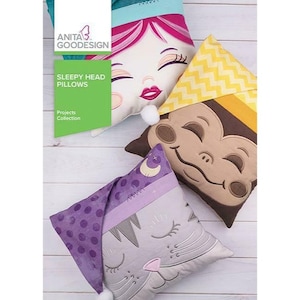May include: Four colorful pillow covers with embroidered faces of a girl, monkey, cat, and a cat wearing a purple hat. The pillows are part of a "Sleepy Head Pillows" project collection.
