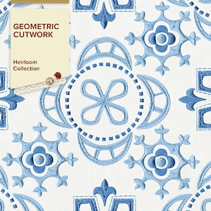 May include: A white fabric background with a blue and white geometric pattern. The pattern is made up of various shapes, including circles, squares, and stars. The text "Anita Goodesign Geometric Cutwork Heirloom Collection" is printed on the left side of the image.