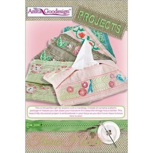 May include: A pink and green embroidered tissue box cover with a floral design. The cover is made to fit a standard tissue box and is a great way to add a touch of elegance to your home.