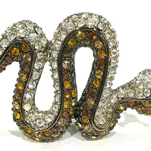 Nice  KJL (Kenneth Jay Lane) Shades of Topaz and Clear Rhinestone Curvy Snake Brooch