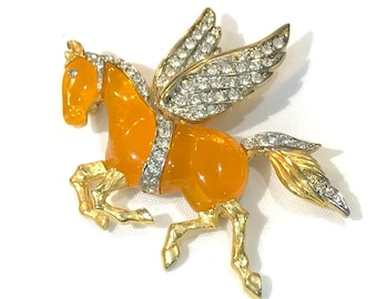 Nice  Vinage KJL (Kenneth Jay Lane) Tangerine Resin and Clear Crystal Pegasus Flying Winged Brooch