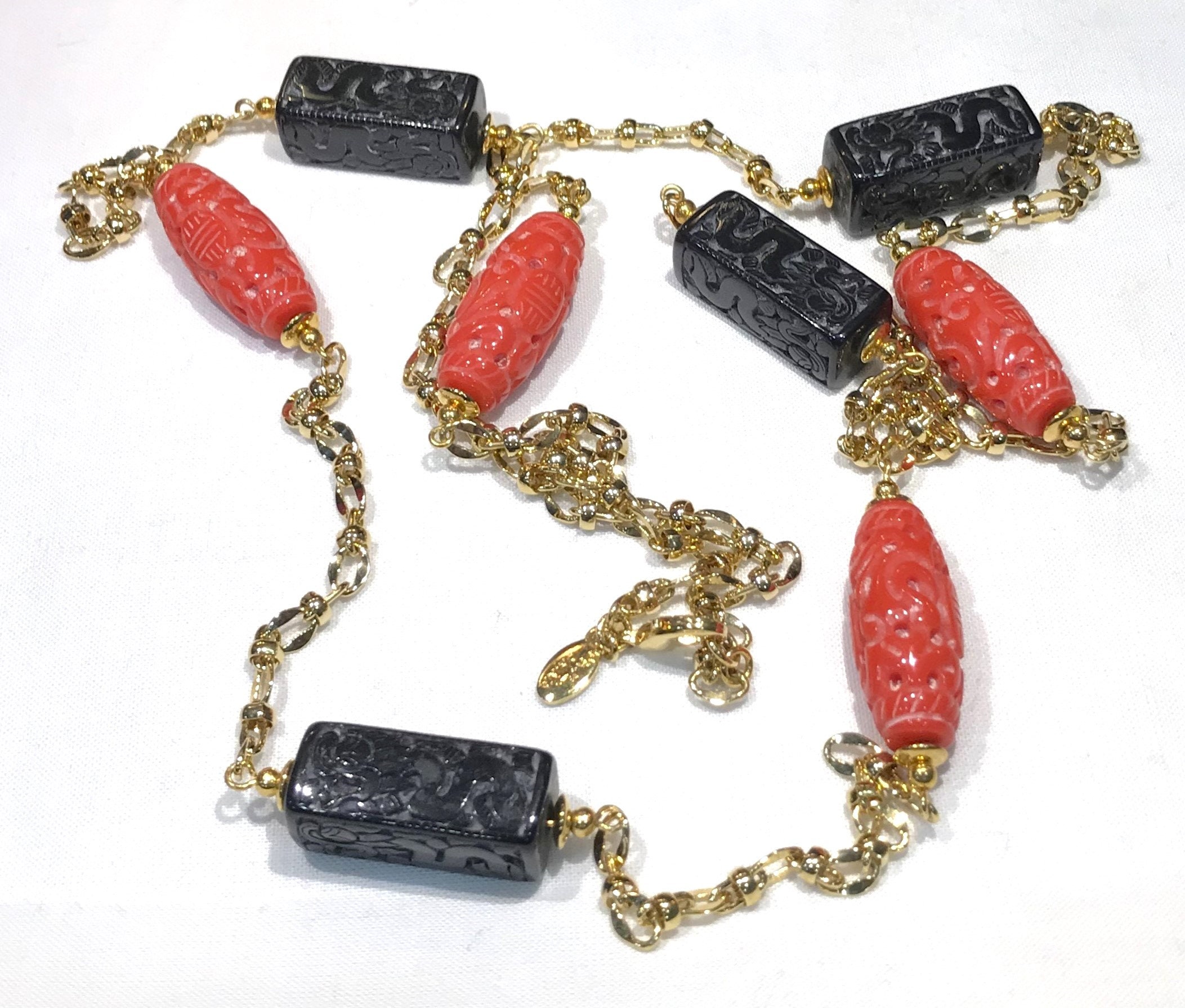 Nice KJL for QVC Asian Motif Carved Red and Black Faux Coral