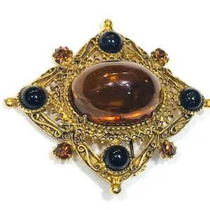 Belle broche vintage en filigrane avec strass et strass florentine vintage, cabochon en verre noir lucite noir et topaze