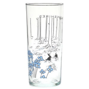 May include: A clear glass drinking glass with a black and white illustration of a forest scene with two rabbits and blue forget-me-not flowers. The text "Berkshires" is printed upside down on the glass.