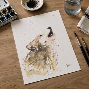May include: A watercolor painting on white paper depicting a wolf howling with its head tilted upward. The artwork features earthy tones of brown, tan, and muted yellow with paint splatters and a signature in the bottom right corner.