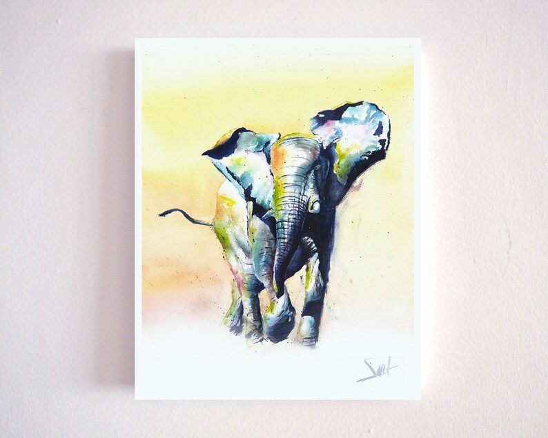 May include: Watercolor painting of a blue and green elephant with a yellow background. The elephant is walking towards the viewer with its trunk raised.