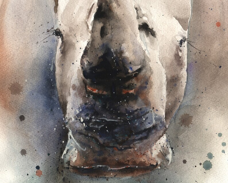 May include: Close-up watercolor painting of a rhinoceros's face. The rhino's skin is a light gray with dark gray and brown accents. The background is a light blue with dark gray and brown splatter paint.