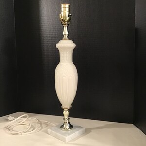 Vintage Art Deco style table lamp is 18 1/2” tall with elegant alabaster look body and marble base