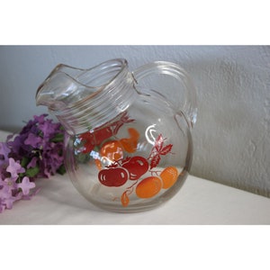 Vintage glass tilt disc orange juice pitcher Very Unique