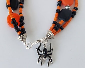 Spider charm orange and black multistrand halloween bracelet