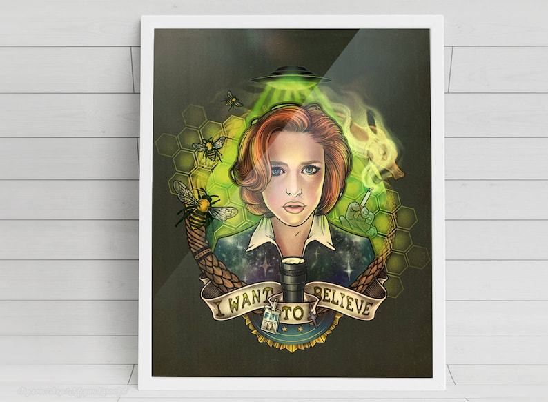 May include: A digital illustration of a woman with red hair, wearing a dark blue jacket with a galaxy print. She is holding a cigarette and a glass of liquid. The background is green and features a honeycomb pattern with bees and a UFO. The text "I WANT TO BELIEVE" is written in a banner.
