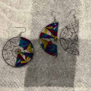 preppy werewolf and a grumpy goth stain glass roomie window earrings