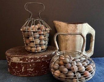 Antique Marbles in Small Wire Egg Basket, Unglazed Pottery Marbles