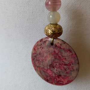 Upcycled Boho hippie stone pendant with crystal accents on suede cord large vintage pink stone on on green suede cord handmade brass bail