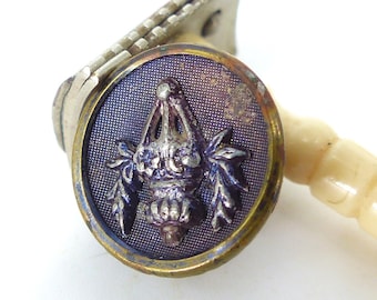 Antique circa. 1900 "Ornate Hanging Plant" purple tint background repurposed as a magnetic tie tack or lapel pin with silk covered back