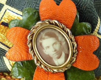 Amazing antique portrait of a handsome man in twisted rope frame rust and olive layered leather lapel magnetic pin. Silk covered back button