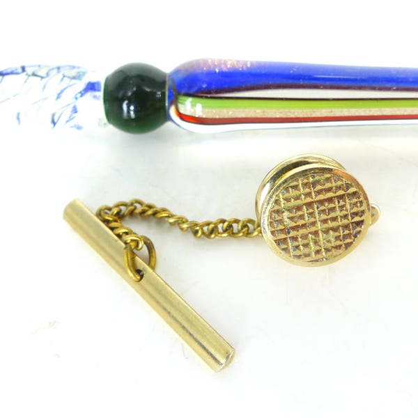 Round gold tie tack with attached bar and chain hardware. Textured crosshatch gold face design. Classic Style.