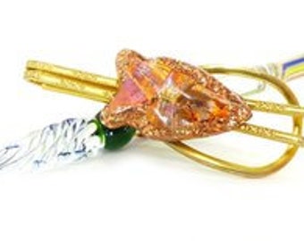 Rare vintage gold loop style tie bar with intricate etched face and peach foil epoxy embellishment. Comes packaged as a gift.