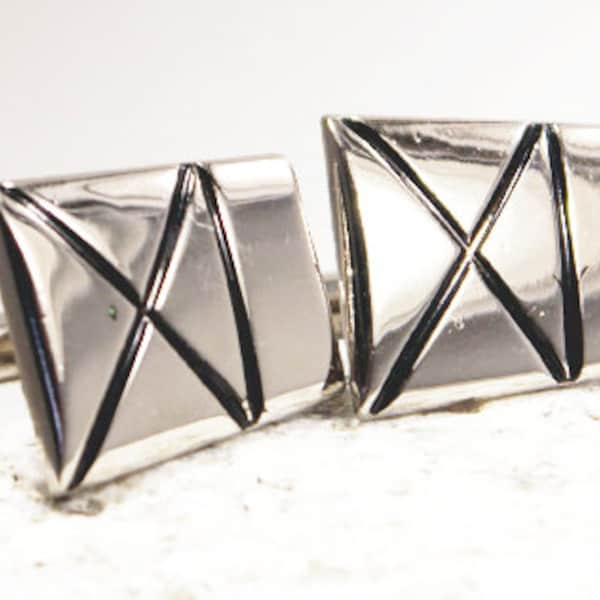 Vintage silver set of cufflinks. Tribal design in silver with black line design. Modern and minimal style.