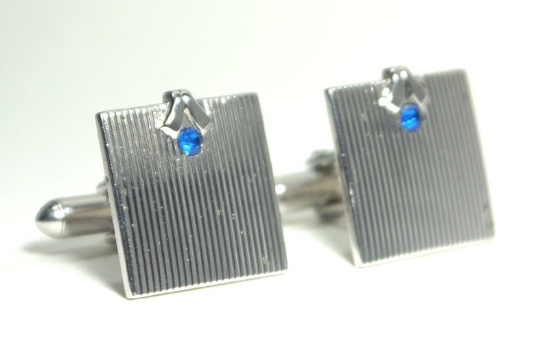 Very Don Draper Square Elegant pair of vintage Swank wedding cufflinks in grooved silver and black with brilliant blue crystal inset