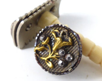 Antique circa. 1900 "Lily & berries" silver and gold setting. Great conversation starter. Silk covered back button