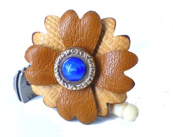 Upcycled antique two tone brown magnetic leather flower with gold and cobalt blue center. Wear a bit of history! Packaged as a gift!