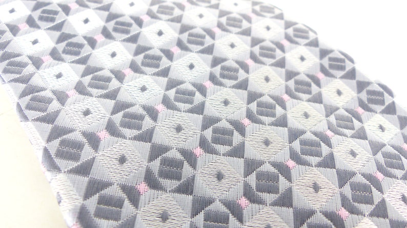 Classic /& beautiful Jon Vandyk woven silk necktie in several shades of gray with little pink square details Hand made in Holland.