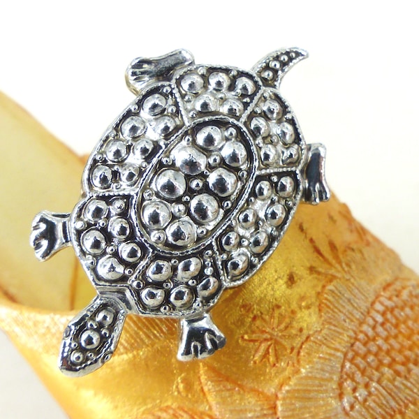 Sweet little his or hers textured silver turtle lapel pin. Latch back closure. Heavy feel metal. Packaged as a gift.