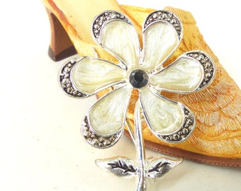 Brilliant silver mod flower brooch in a pearled enamel design with black faceted crystal center. Latch pin back. Free gift packaging