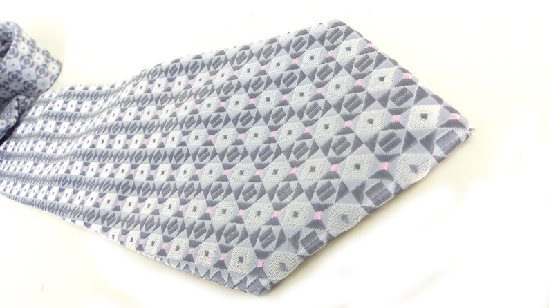 Classic /& beautiful Jon Vandyk woven silk necktie in several shades of gray with little pink square details Hand made in Holland.
