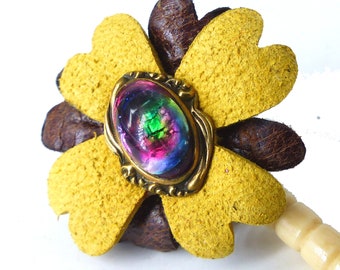 Upcycled antique brown and chamois magnetic leather flower with black opal look center. Silk covered back button. Wear a bit of history!
