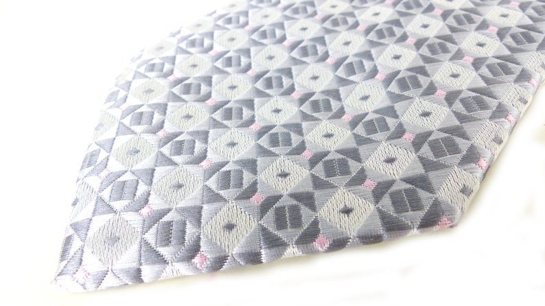Classic /& beautiful Jon Vandyk woven silk necktie in several shades of gray with little pink square details Hand made in Holland.
