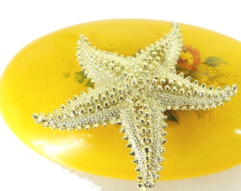 Brilliant light gold textured starfish lapel pin brooch. Zoom in see details. Quality heavy feel metal. Latch pin back. Free gift packaging