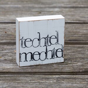 Arte de texto na parede "techtelmechtel"
