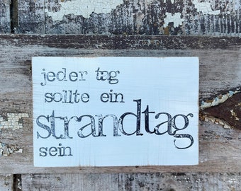 Text picture on the wall "strandtag"